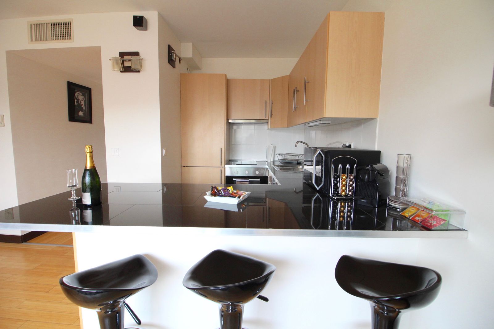 Kitchen bar counter with Nespresso coffee machine and complimentary champagne welcome setup